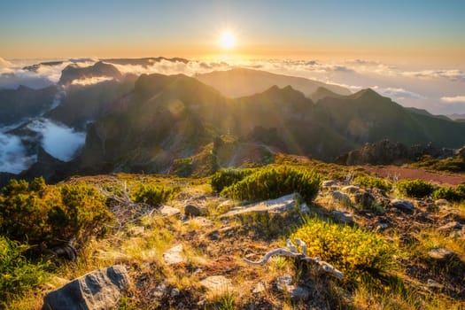 View of mountains over clouds from Pico Ruivo on sunset. Madeira island, Portugal