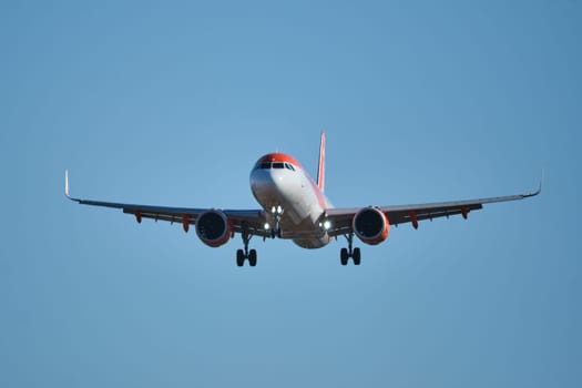 Lisbon, Portugal - September 2, 2023: easyJet Airbus A320-214 passenger plane descends to land in Humberto Delgado Airport in Lisbon