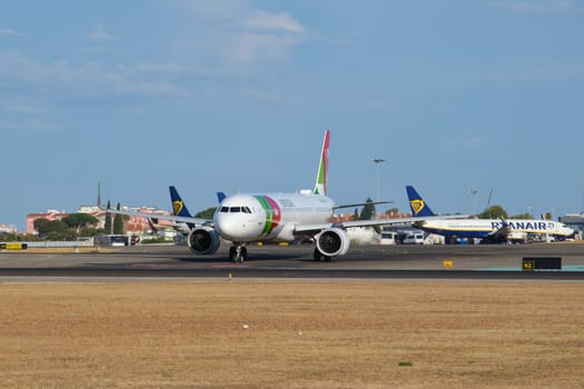 Lisbon, Portugal - September 2, 2023: TAP Portugal Airbus A321-251NX passenger plane taxi on runway in Humberto Delgado Airport in Lisbon