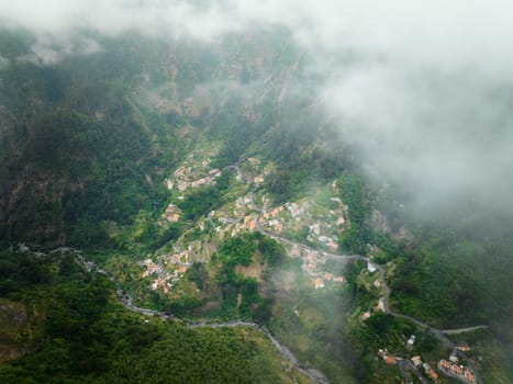 Aerial drone view of Curral das Freiras village in Valley of the Nuns from Miradouro da Eira do Serrado, Madeira island, Portugal