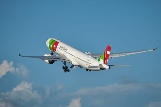 Lisbon, Portugal - September 2, 2023: TAP Air Portugal Airbus A330-941 passenger plane in sky after take off in Humberto Delgado Airport in Lisbon