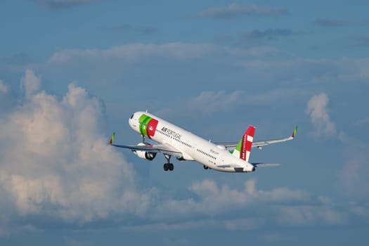 Lisbon, Portugal - September 2, 2023: TAP Air Portugal Airbus A321-251NX passenger plane in sky with clouds after take off in Humberto Delgado Airport in Lisbon