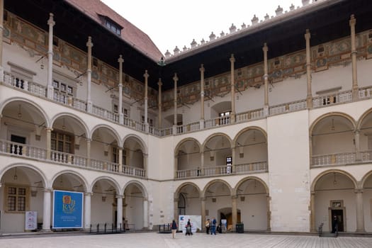 Cracow, Poland - October 1, 2023: The arcaded Renaissance-style courtyard at Wawel Royal Castle on Wawel Hill