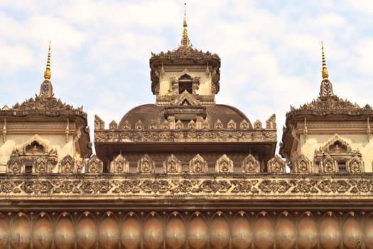 The elaborate roof and turrets, towers of the Patuxai Monument, decorated with a lot of stucco in different patterns and shapes, Vientiane, Laos 2023