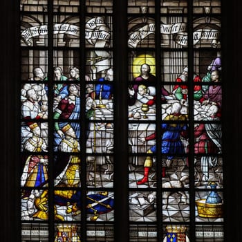 Gouda, the Nehterlands - April 20, 2023: The Stained glass window the Last Supper by Dirk Crabeth in the Sint Janskerk