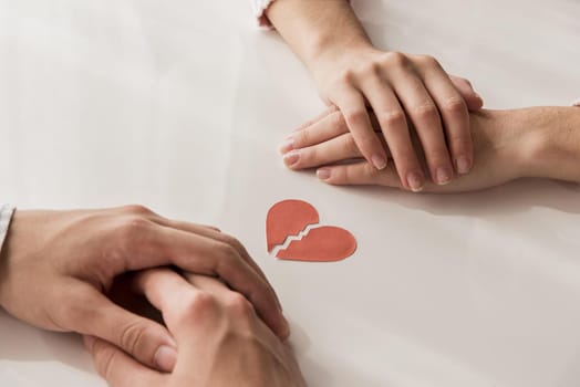 close up hands with broken heart. High resolution photo