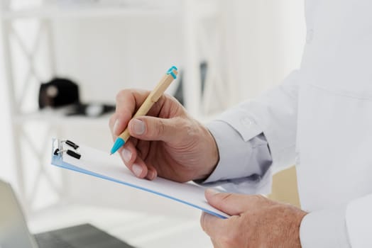 close up doctor writing clipboard. High resolution photo