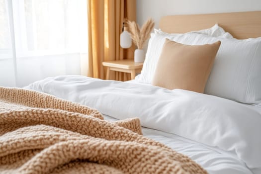 Bright minimalist bedroom with soft textiles and warm tones, promoting relaxation and comfort.