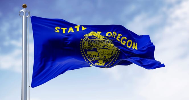 Oregon state flag waving in the wind on a clear day. The Oregon flag is two-sided with navy blue and gold colors. 3d illustration render. Fluttering fabric. Waving flag