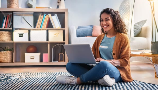 young female student seated on the floor with laptop pc, AI generated image