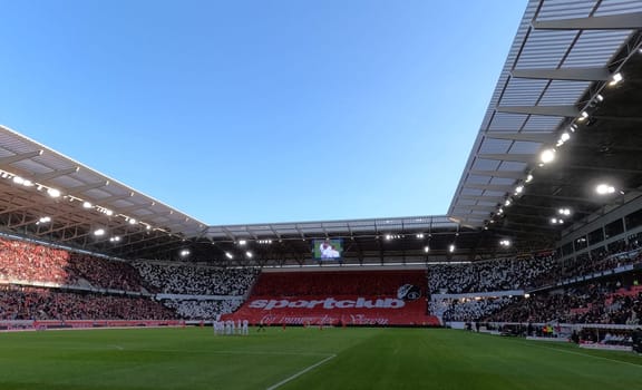 Freiburg fan curve with choreography "Sportclub Freiburg für immer der Verein"" at the match of the 1st FBL: 24-25: 1st FBL: 24-25: 9th Sptg. SC Freiburg - FSV Mainz 05  DFL REGULATIONS PROHIBIT ANY USE OF PHOTOGRAPHS AS IMAGE SEQUENCES AND/OR QUASI-VIDEONann  Photo: Joachim Hahne/johapress"