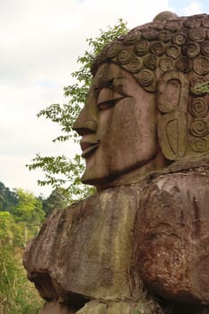 The head of a Sandstone Buddha Rock Sculpture on the Thakhek Motorbike Loop, Laos 2023