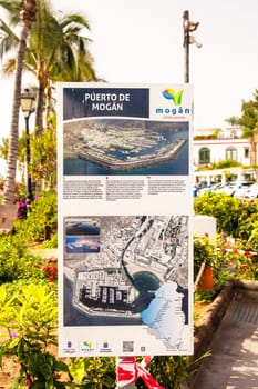 Gran Canaria, Spain, Jul 18, 2024. An information sign about Puerto de Mogan, also called little Venice, with a small fishing harbour, romantic alleys and beautiful architecture.