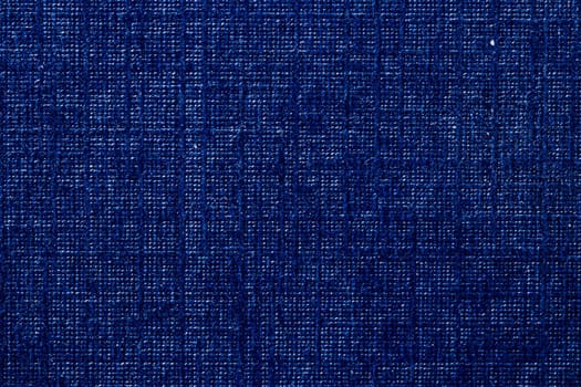 Seamless Cardboard box texture background. Close-up of a detail from a dark blue surface of a gift box. Beautiful backdrop. Macro.