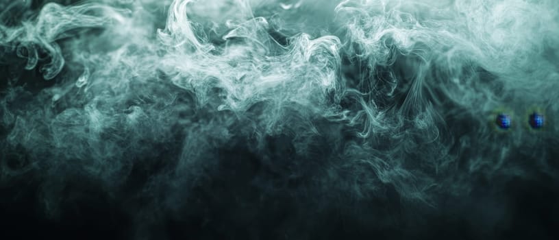Ethereal teal smoke swirling against a dark background, creating a mysterious and atmospheric visual effect.