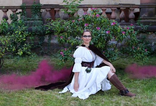 Fantasy shot with a sorceress and purple smoke