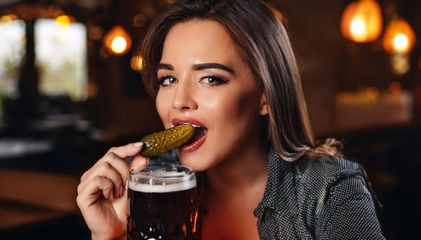 gorgeous young woman drinking beer at the pub, AI generated image