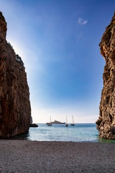 Cruise ships moored in the bay, Sa Calobra, Escorca, Paraje Natural de la Serra de Tramuntana, Balearic Islands Mallorca Spain. Travel agency vacation concept.