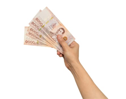 Asian woman holding Thai baht banknote money in hand isolated on white background with clipping path.