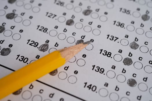 Answer sheets with pencil drawing fill to select choice, education concept.