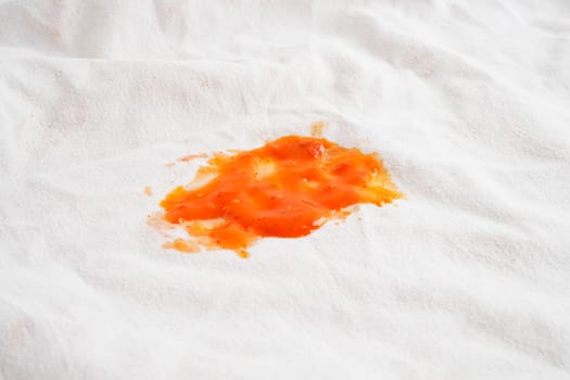 Dirty tomato sauce stain or ketchup on cloth to wash with washing powder, cleaning housework.