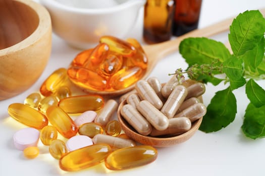 Alternative medicine herbal organic capsule with vitamin E omega 3 fish oil, mineral, drug with herbs leaf natural supplements for healthy good life.