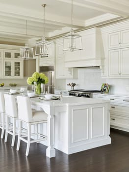A sophisticated white kitchen featuring a large island, elegant cabinetry, and modern appliances, exuding luxury and style.