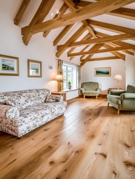 A country style living room featuring exposed wooden beams and floral patterned furniture.