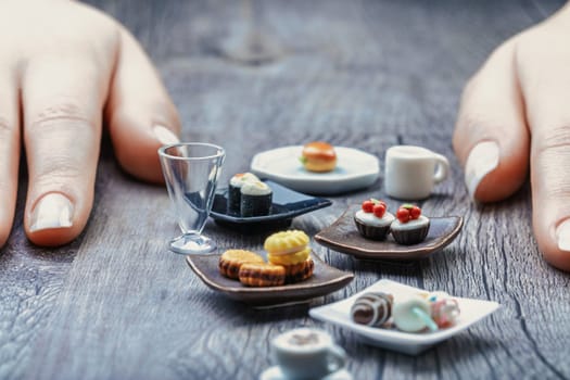 These miniature sushi, pastries, and coffee represent proper nutritional portions. While tempting and visually delightful, they feel tiny and unsatisfying without discipline to manage cravings