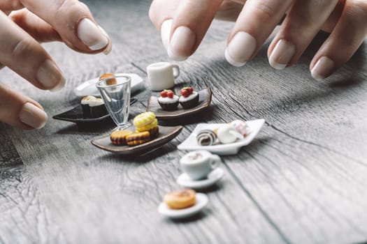 Tiny servings of sandwiches, sushi, and cappuccinos illustrate the struggle with portion control. Though delicious, these miniature sizes feel unsatisfying despite meeting nutritional guidelines