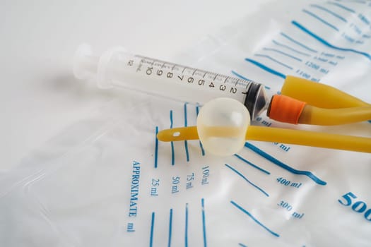 Foley catheter and urine drainage bag collect urine for disability or patient in hospital.