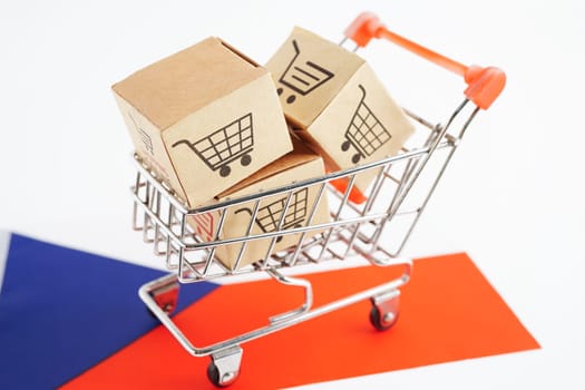 Online shopping, Shopping cart box on Czech flag, import export, finance commerce.
