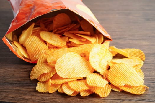 Potato chips , delicious BBQ seasoning spicy for crips, thin slice deep fried snack fast food.