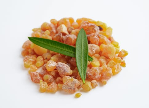 Frankincense or olibanum aromatic resin isolated on white background used in incense and perfumes.