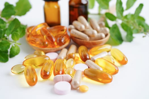 Alternative medicine herbal organic capsule with vitamin E omega 3 fish oil, mineral, drug with herbs leaf natural supplements for healthy good life.