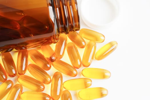 Fish oil or Cod liver oil gel in capsules with omega 3 vitamins, supplementary healthy food