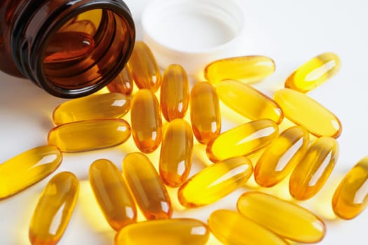 Fish oil or Cod liver oil gel in capsules with omega 3 vitamins, supplementary healthy food
