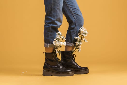 woman legs wearing boots with flowers inside. Resolution and high quality beautiful photo