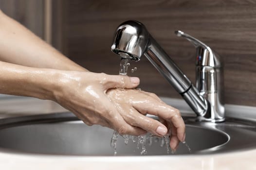 woman washing hands sink. Resolution and high quality beautiful photo