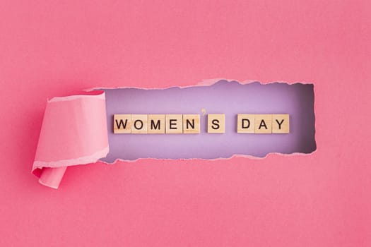 women s day written in scrabble letters and torn paper. Resolution and high quality beautiful photo