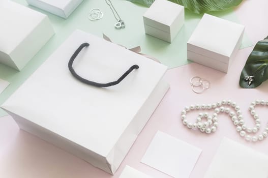 white shopping bag gift boxes with jewelry colored background. Resolution and high quality beautiful photo