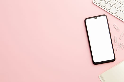 working woman pink desk with phone and copy space. Resolution and high quality beautiful photo