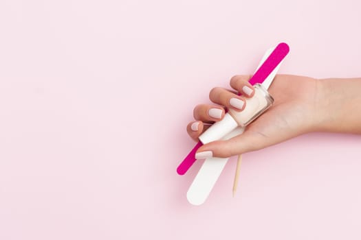 woman holding manicure tools with copy space. Resolution and high quality beautiful photo