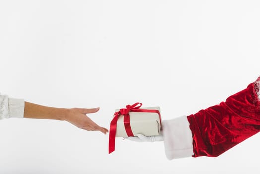 young woman taking small gift box santa claus. Resolution and high quality beautiful photo