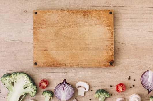 wooden chopping board with broccoli tomatoes onion mushroom black pepper table. Resolution and high quality beautiful photo