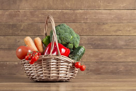 wooden background with basket full vegetables. Resolution and high quality beautiful photo
