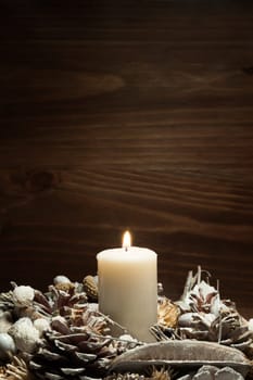 white candle lit with pine cone ornaments. Resolution and high quality beautiful photo
