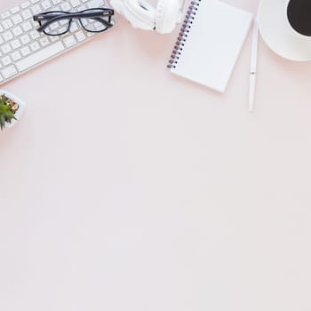 workplace with various gadgets notebook coffee cup pink background. Resolution and high quality beautiful photo