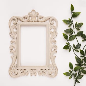 wooden carving frame near artificial leaves white backdrop. Resolution and high quality beautiful photo