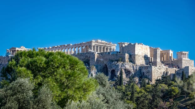 Acropolis in Athens, Greece. View of the beautiful hill on which the Acropolis rises. Acropolis of Athens is the most striking and complete ancient Greek monumental complex still existing in our times